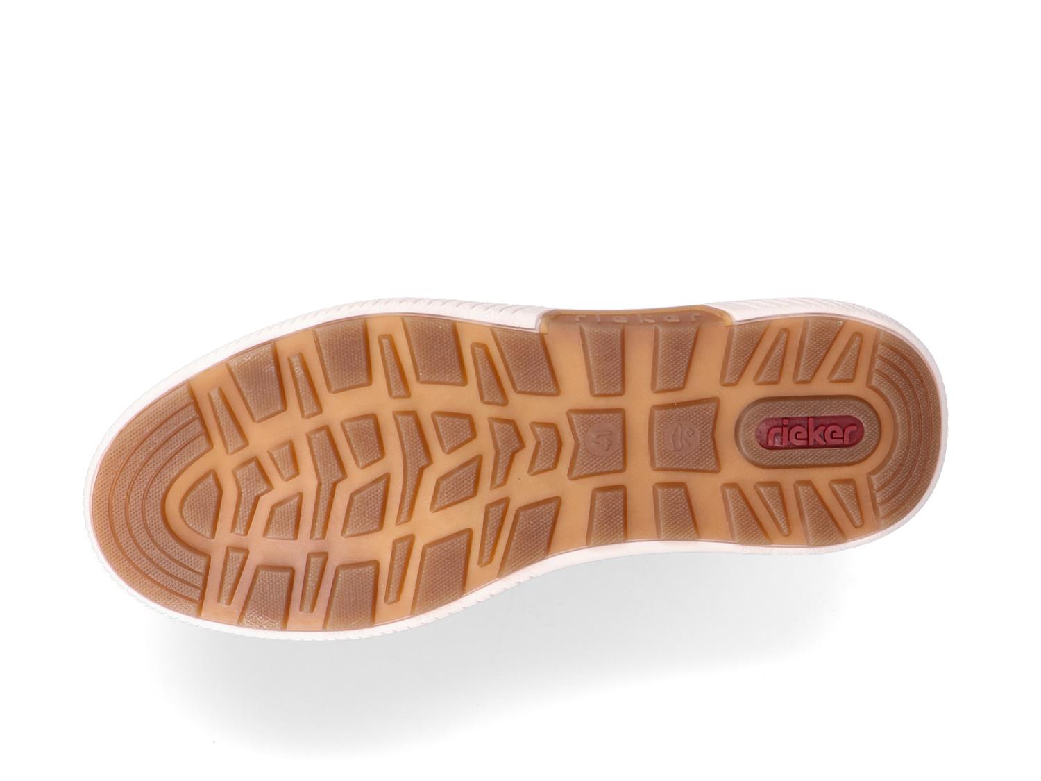 Bildet viser sålen på 05406 Rieker Softfoam Sneaker fra Rieker Comfort & Style, med en lysebrun teksturert slitebane og en rød RIEKER-logo nær hælen, designet med Antistress-teknologi for økt komfort.