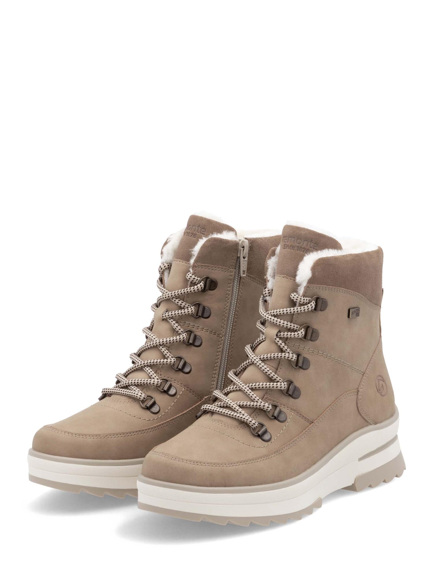 Remonte 05022 Fiber-Grip-støvlene har TEX-membran, overdel i skinn, ullfôr, glidelåser på sidene, hvite såler og snøring - perfekt for varme og komfort.