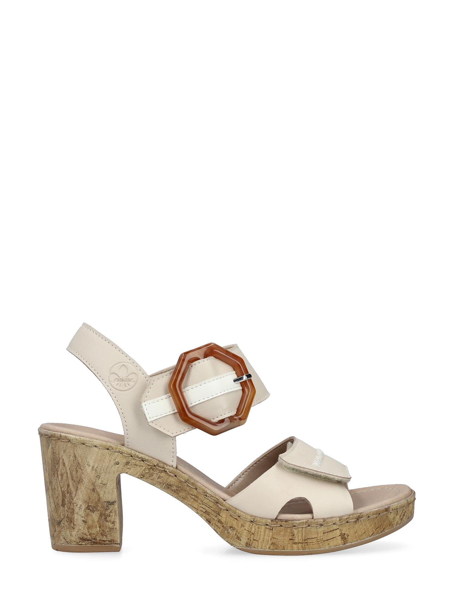 07639 Rieker Tropical High Sandal fra Rieker Comfort & Style er en beige sandal med korksåle, antistress-teknologi for komfort, chunky hæl, to remmer og en stor åttekantet brun spenne på siden.