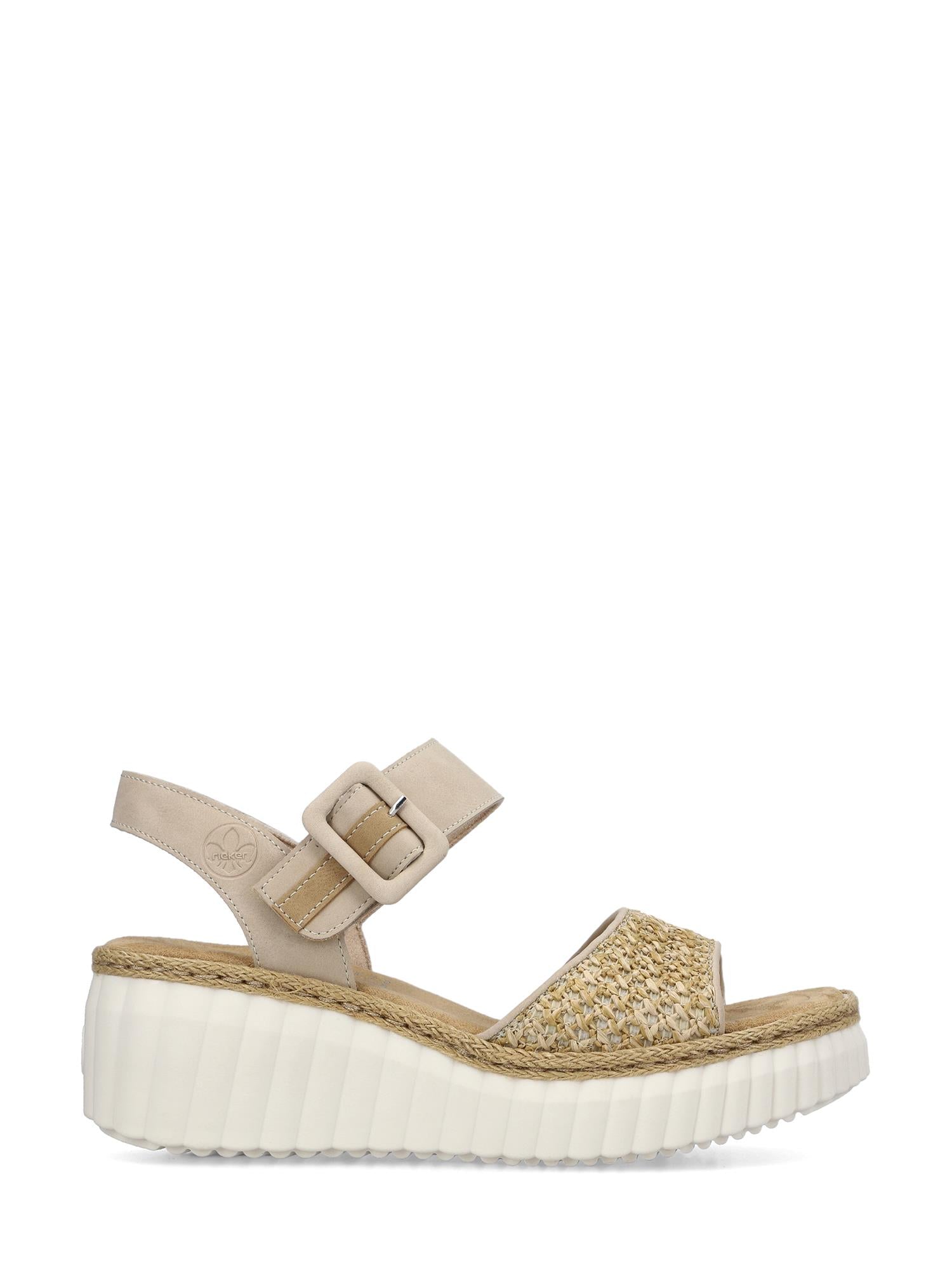 03047 Rieker Celensa Sandal Beige fra Rieker Comfort & Style har en vevd tårem, justerbar vriststropp med spenne og en tykk, riflet hvit platåsåle med antistress-teknologi for varig komfort.