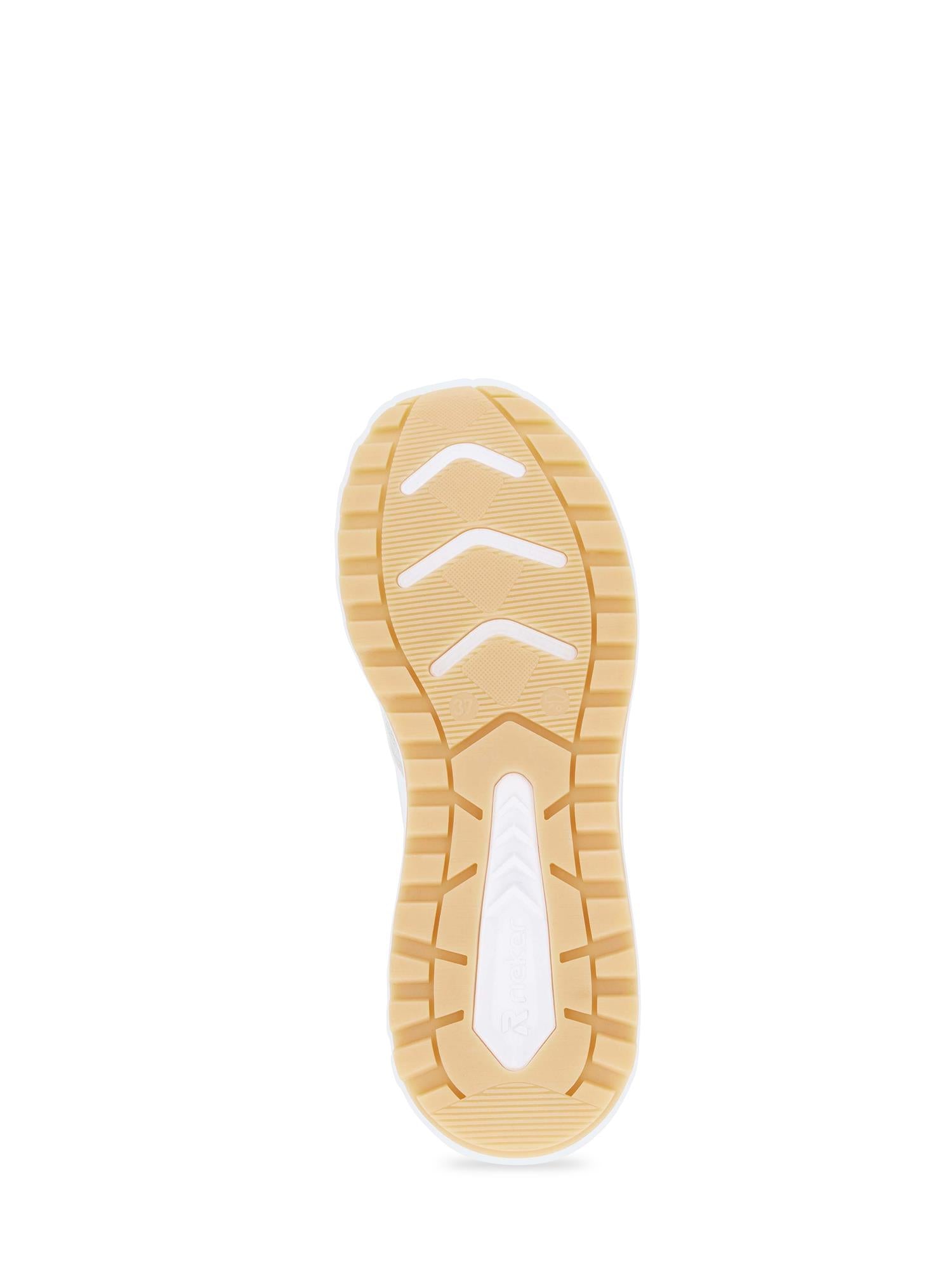 03546 Rieker TrailMotion Hvit Semsket-sneakeren fra Rieker Sport har en beige og hvit gummisåle med mønstret slitebane, buede spor for grep, en teksturert kant og god komfort for daglig bruk.