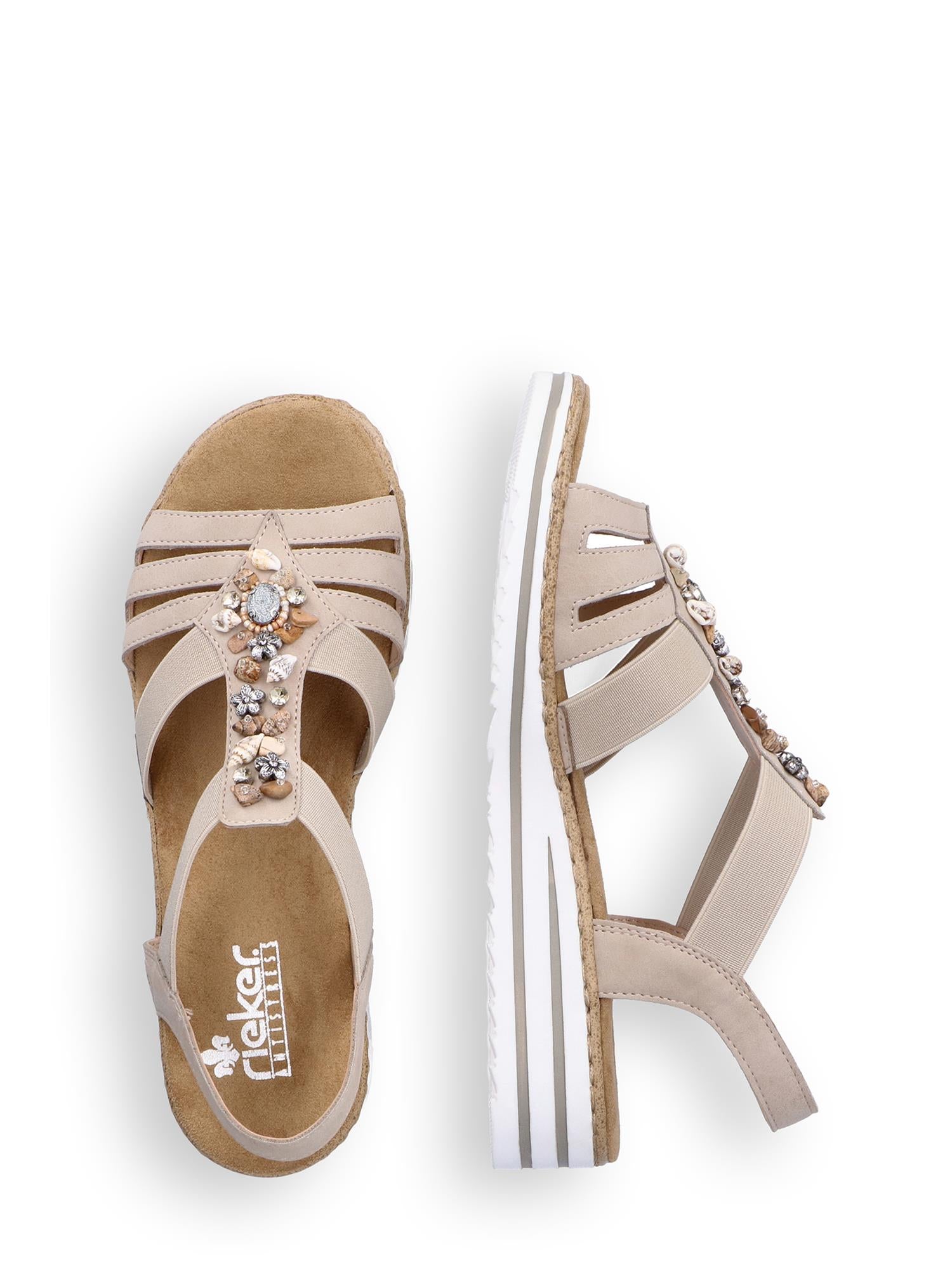 Beige 08090 Rieker Crystal Shell-sandal fra Rieker Comfort & Style med dekorative rhinestones, elastiske remmer, hvit/beige kilehæl og myk såle. Brandlogo synlig inni øverste skoen. Vist fra toppen og siden.