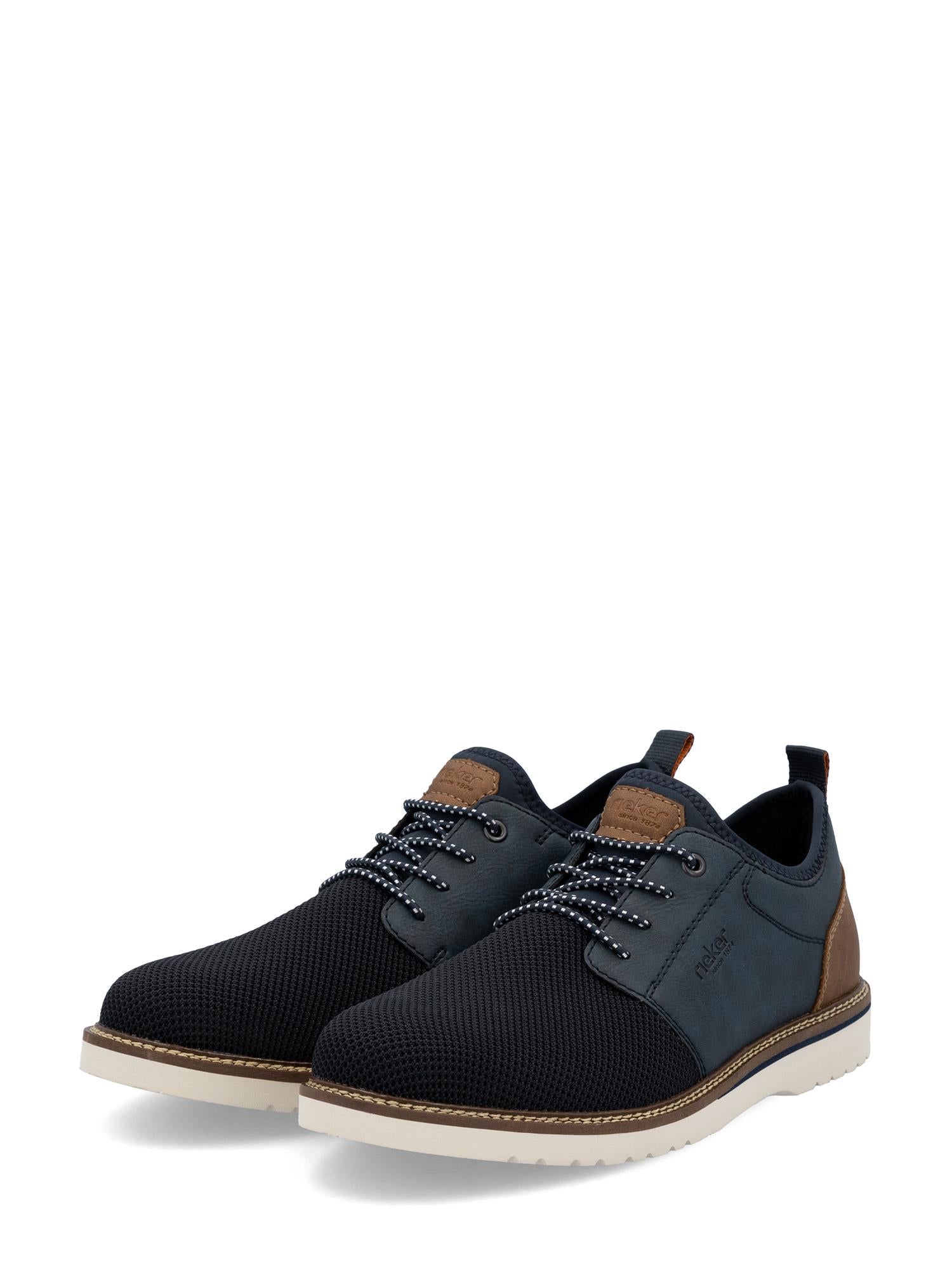 Et par stilige marineblå Rieker EasyWalk slip-ons fra Rieker Comfort & Style med hvit såle og sporty design, som gir eksepsjonell komfort til hverdagsbruk.