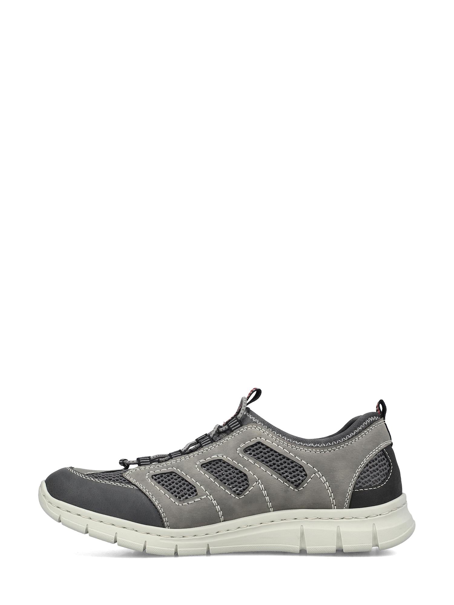 07655 Rieker Luftig Tursko fra Rieker Comfort & Style er en grå/svart casual sneaker med meshpaneler, hvite sømmer og en hvit såle. Den lave profilen, de elastiske lissene og antistresssålen gjør den perfekt som sommerfottøy.
