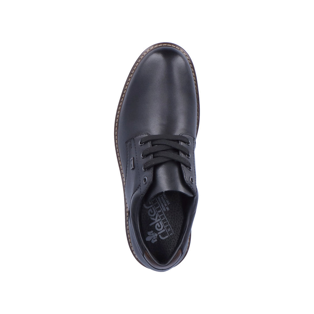 Oversiktsbilde av en 04905 Rieker Shoes Classics i svart skinn, med snøring, brune sålesømmer og synlig Rieker Comfort & Style-logo med tekst på innersålen.