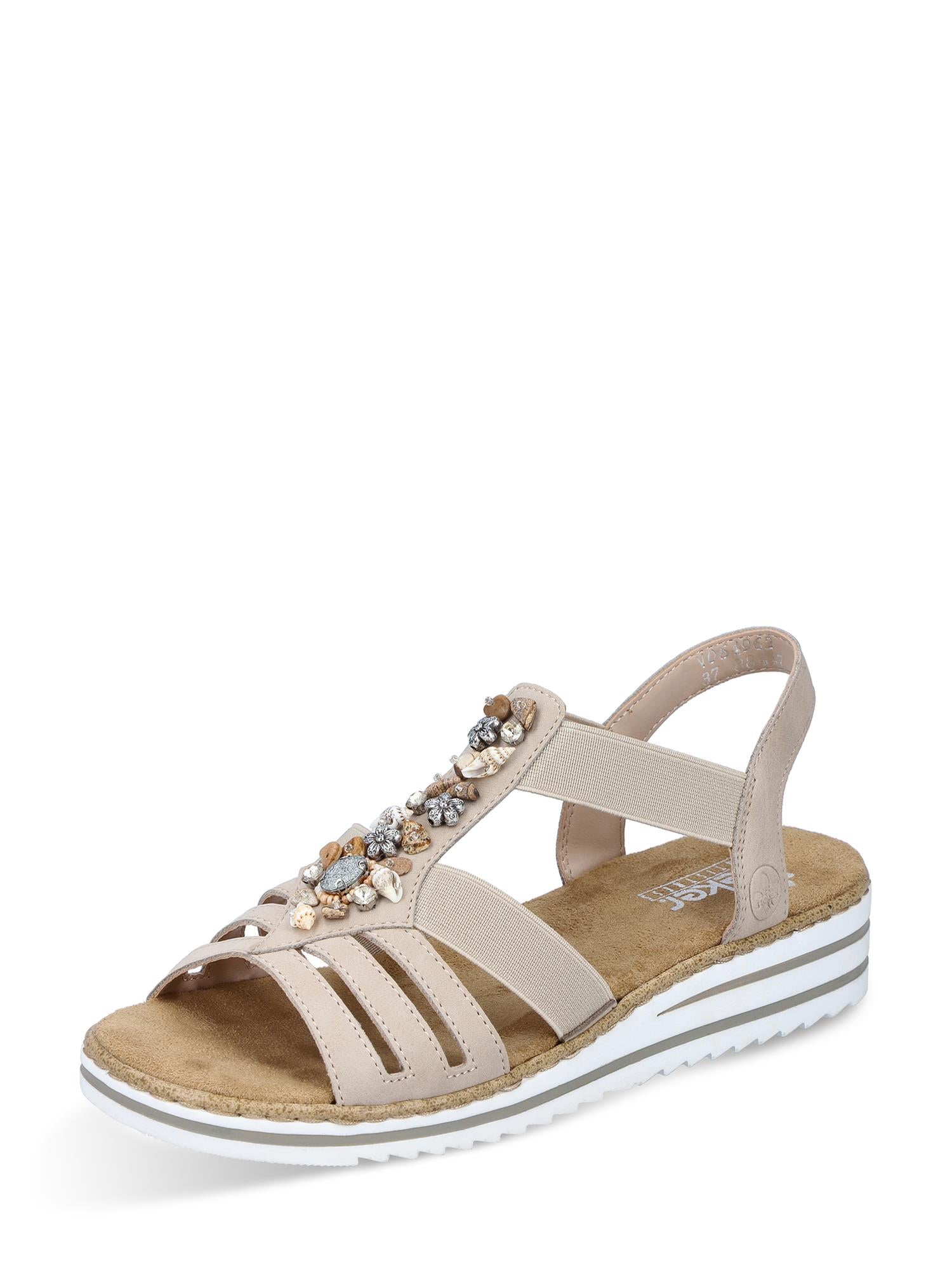 08090 Rieker Crystal Shell fra Rieker Comfort & Style er en beige sandal med dekorative edelstener, elastiske sideremmer, åpen tå, polstret myk såle, hvit såle med grå striper og en lav kilehæl.