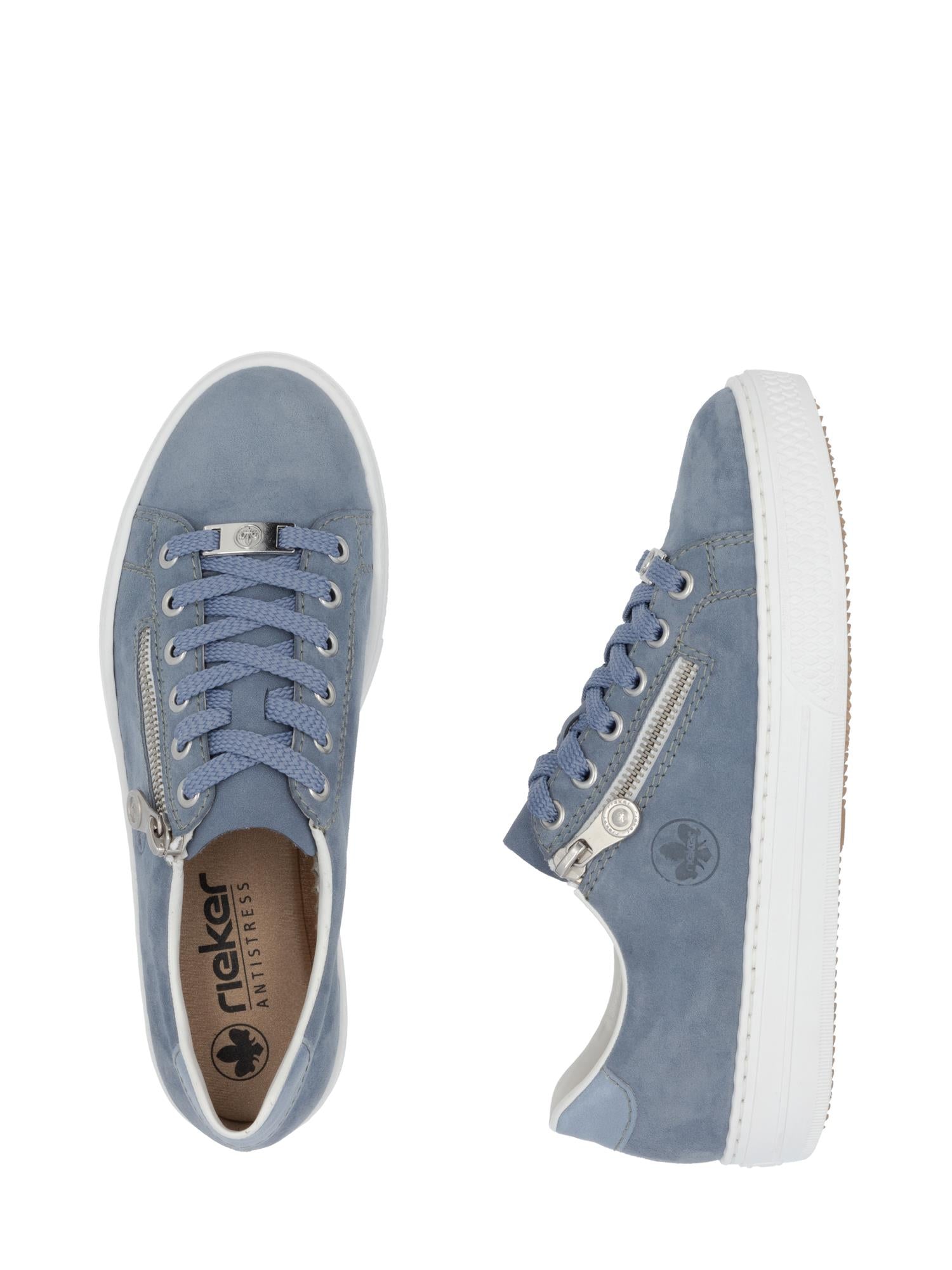 03154 Rieker Vital Comfort Sneakers Blå fra Rieker Comfort & Style har lyseblå overdel, hvite såler, sølvfargede glidelåser på siden, blå lisser, merkedetaljer og antistress-såle for overlegen komfort i hvert steg.
