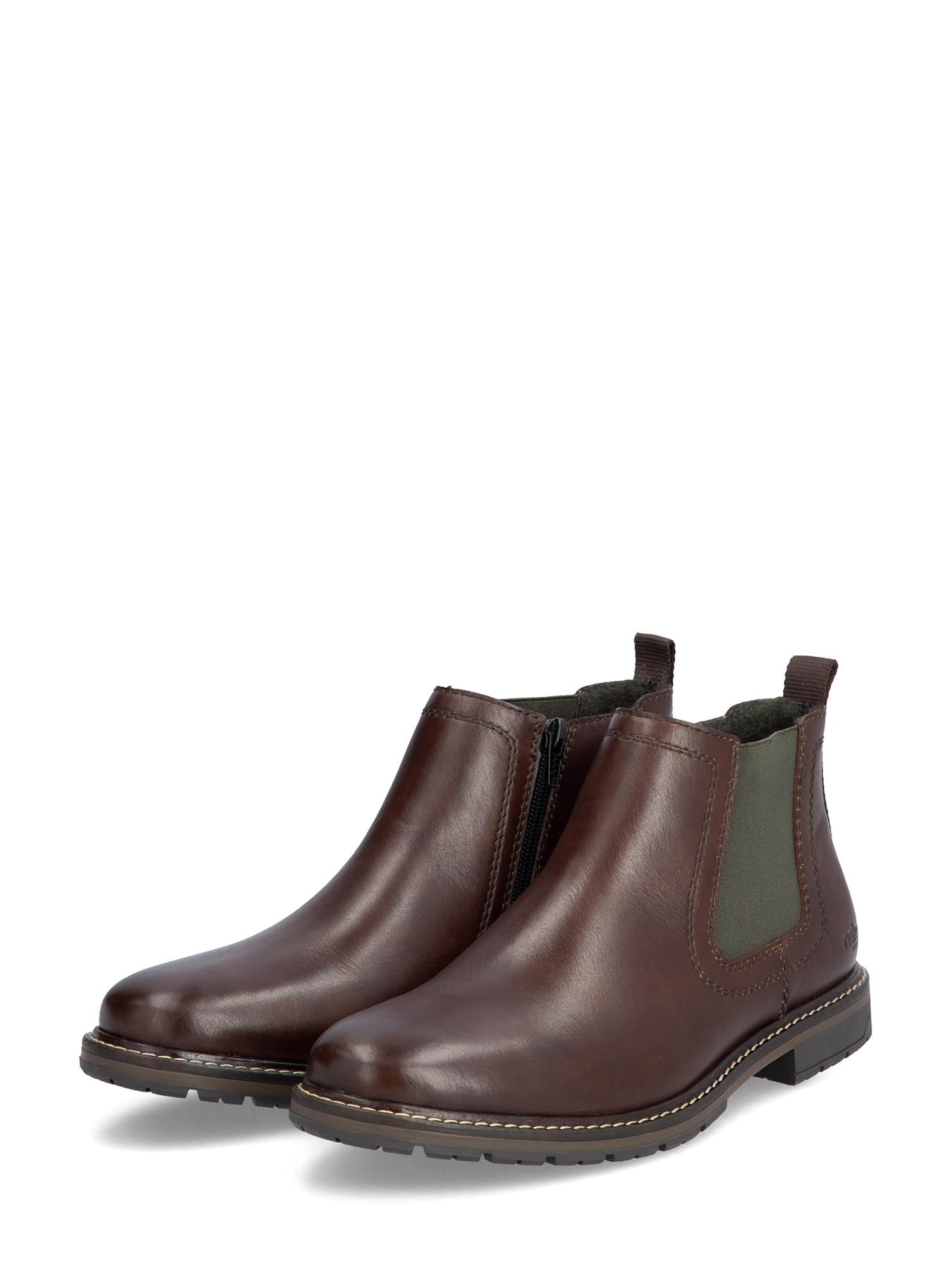 04887 Rieker Classic Leather Boots Brown fra Rieker Comfort & Style er brune skinnstøvler for menn med elastiske sidepaneler, trekkfliker, lav hæl, synlige sømmer og glidelås på siden for enkel bruk.