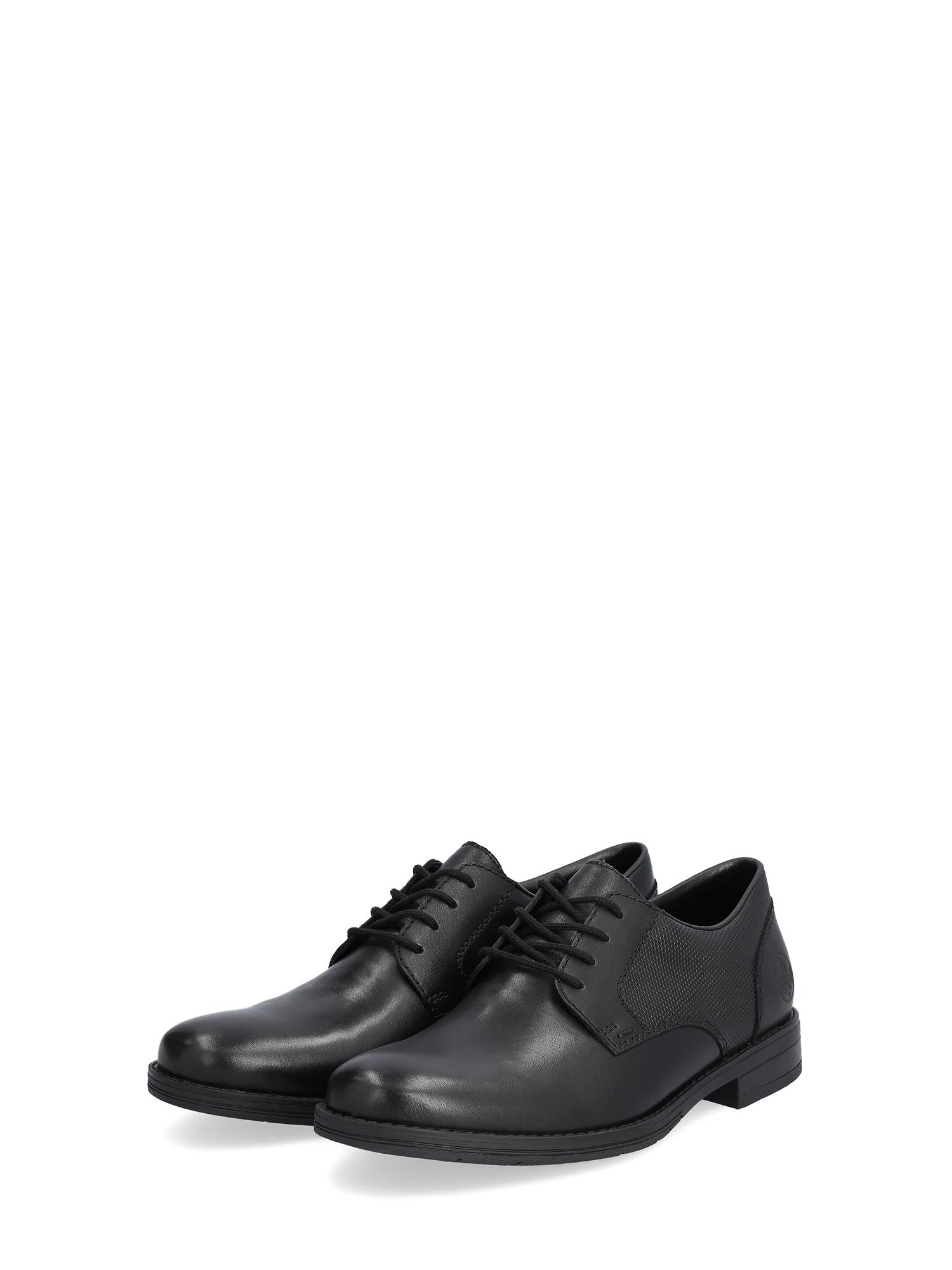 Rieker Comfort & Style 07525 Berlin Leather Dressko er svarte snøresko med lave hæler, sidesømmer og avrundede tær for komfort, vist på en vanlig hvit bakgrunn.