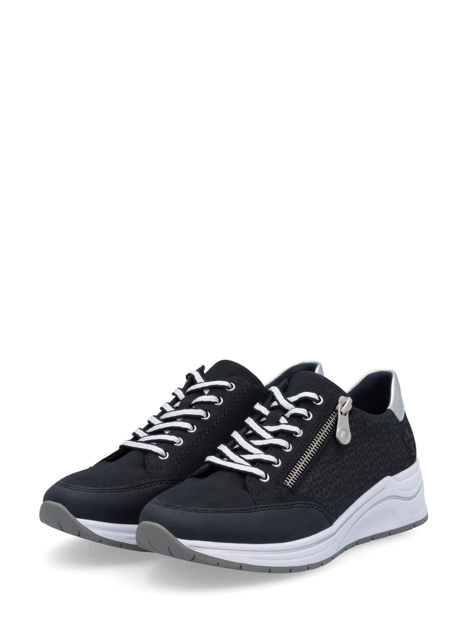 03285 Rieker Comfort Glide fra Rieker Comfort & Style er svarte snøresneakers med hvite såler og lisser, subtile sidemønstre, sølvglidelåser og signaturkomfort.